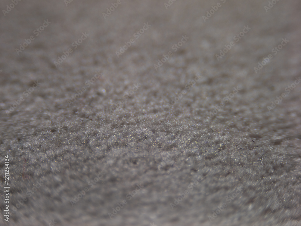 Poster a close up of a carpet with a grainy texture