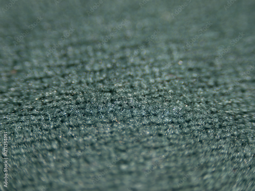 Poster the image is of a carpet with a blue and green color