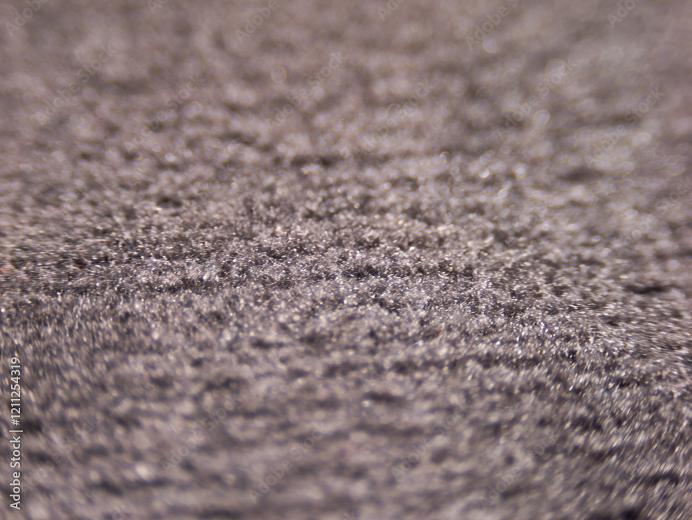Poster a close up of a carpet with a grainy texture