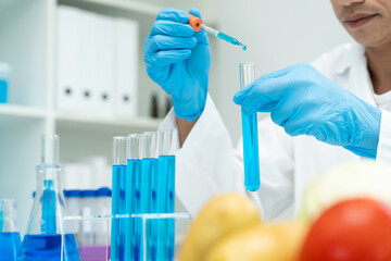 Scientist check chemical food residues in laboratory. Control experts inspect quality of fruits, vegetables. lab, hazards, ROHs, find prohibited substances, contaminate, Microscope, Microbiologist