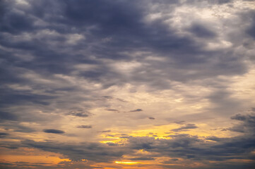 blue clouds against an orange sky at dawn in the morning