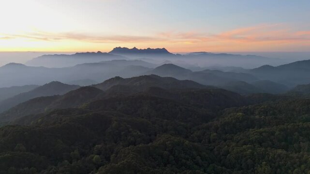 Aerial view foggy mountain forest landscape with morning colorful sunrise sky. (Doi Luang Chiang Dao) thailand . nature background.