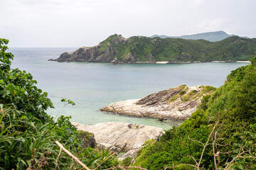 Naklejka premium Empty sea and mountain road in spring at Aka Island, Zamami Village, Okinawa Prefecture, Japan