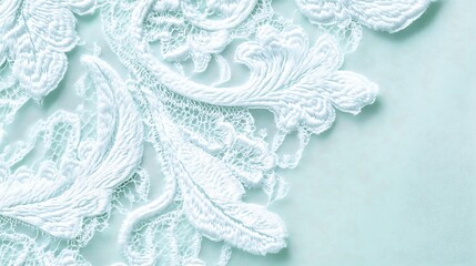 Obraz premium Delicate White Lace on Pale Green Fabric