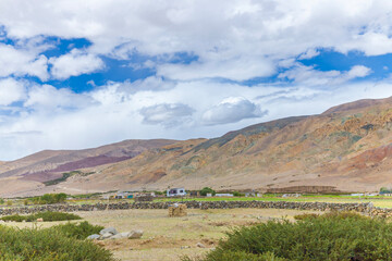 Beautiful  mountains  with old houses at Tsaka La Road Nyoma, near Tara Post in Ladakh, situated on the border with India and China, Leh, Ladakh, India.