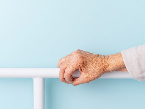 Modern Senior Mobility Aid Design Close-Up of Textured White Handle Against Minimalist Blue - Empowerment in Elderly Care Marketing and Independence Solutions