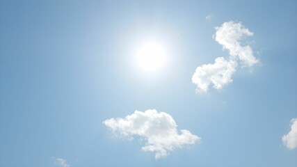 tropical beach with turquoise water and white clouds in the blue sky