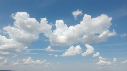 Blue sky background with white clouds. Cumulus white clouds in the blue sky.