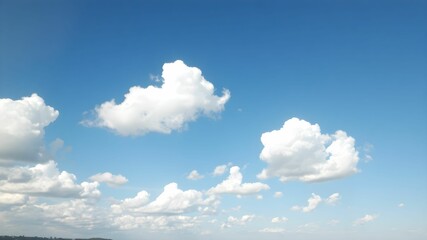 Blue sky background with white clouds. Cumulus white clouds in the blue sky.