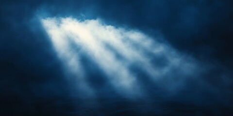 Mystic Light Beams Piercing Dark Clouds: A Dramatic Blue Scene