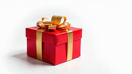 Obraz premium A vibrant red gift box adorned with a luxurious gold ribbon, a perfect symbol of celebration and thoughtful presentation.