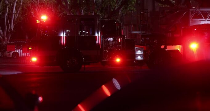 A fire engine responds to the scene of an emergency at night.