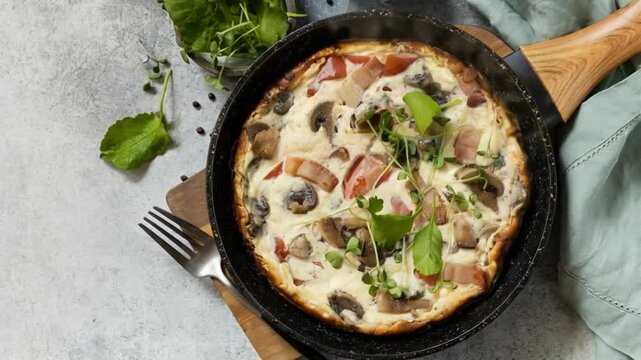 Delicious homemade frittata with fresh herbs and vegetables cooking sequence in skillet