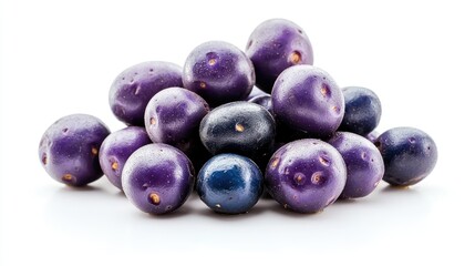 Pile of purple and blue berries on white background.  Food photography for recipe blogs or packaging