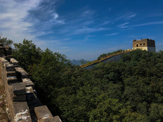Great Wall Watchtower Amid Verdant Forest and Blue Sky