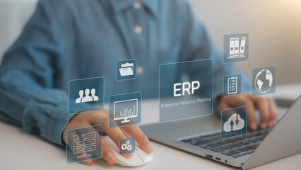 ERP enterprise resource and planning concept. Businessmen use laptops to document management and analyze ERP systems on virtual screens. Connections between business intelligence.