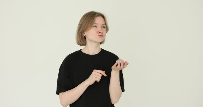 Silver bell in the hands of woman to attract attention, press bell