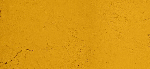 Yellow textured wall background with rough surface details, ideal for use in creative designs and architectural presentations.