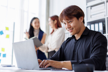 Brainstorming Collaboration and  successful partnership analysis by Team of Young business Asian people working in an office workspace
