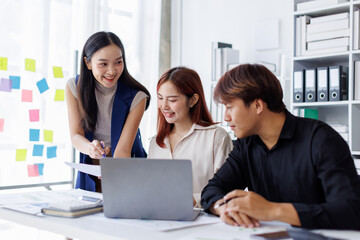 Brainstorming Collaboration and  successful partnership analysis by Team of Young business Asian people working in an office workspace