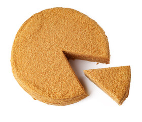 Golden brown pie with a slice cut out, set against a white background in a dessert presentation
