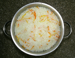 Cook healthy rice with vegetables. A close-up shot of a cooking scene.
