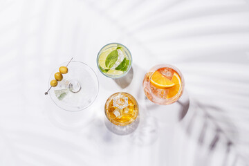 A vibrant display of cocktails, including Aperol Spritz, Mojito, and Martini