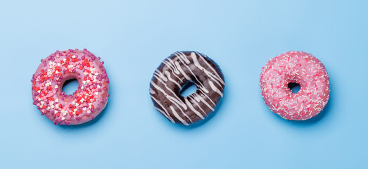 An assortment of vibrant donuts with colorful toppings