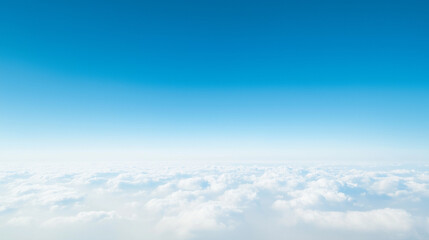 Above the Clouds: A serene panorama of fluffy white clouds stretching endlessly beneath a vast, azure sky, evoking a sense of tranquility and boundless possibility. 