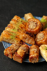 Delightful assortment of traditional pastries showcased on a decorative plate in a warm setting