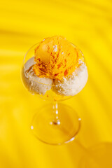A refreshing ice cream set against a vibrant yellow background