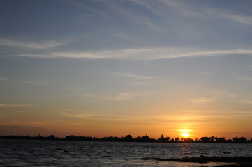 Sunset at the Nuwara Wewa artificial lake and largest of the three man-made reservoirs on the east side of the Anuradhapura city in Sri Lanka
