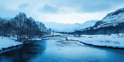 Obraz premium Serene winter river winding through a snow-covered valley with blue hues and cloudy skies, showcasing tranquil nature in a chilly landscape.