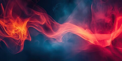 Fototapeta premium Vibrant swirling smoke in shades of red and orange against a deep blue background creating a dramatic abstract lighting effect.