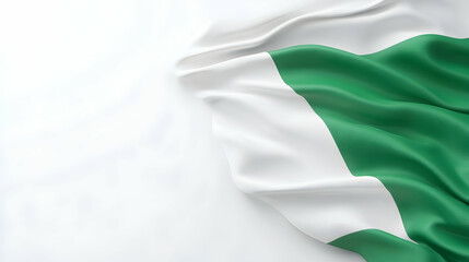 Obraz premium Draped Nigerian flag on white background; space for text; patriotic website design