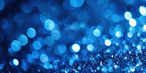 Vibrant blue bokeh light background featuring soft circular shapes with gradients of deep and light blue creating a dreamy atmosphere ideal for designs