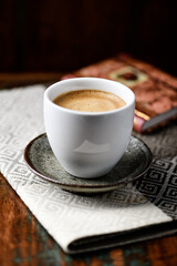 Cup of coffee on wooden background. Soft focus. Copy space.