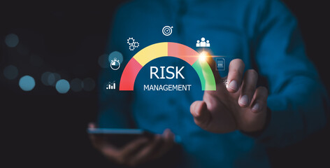 Risk management strategy concept. Businessman Analyzing Risk touchscreen display risk meter, risk management interface with critical strategy. Risky business risk management control and strategy.