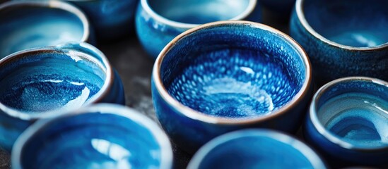 Vibrant blue glazed pottery pieces arranged closely showing rich shades of blue and intricate craftsmanship in a beautifully organized composition