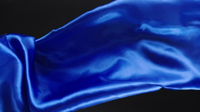 Abstract soft blue silk background luxury wave cloth satin pastel color fabric. 