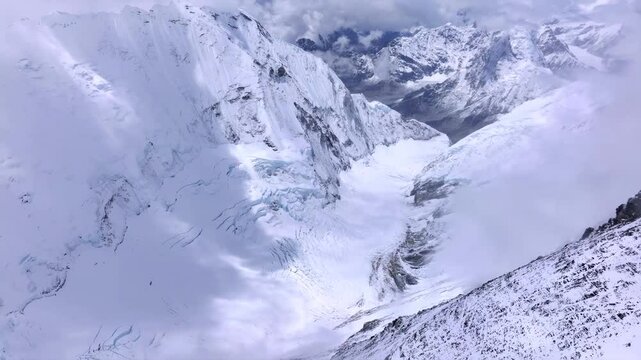 4K aerial video offering a sweeping view of the world’s highest glacier, the White Dragon route to Mount Everest's summit. It originates from the 7,600-meter-high mountain wall of Lhotse, the fourth h