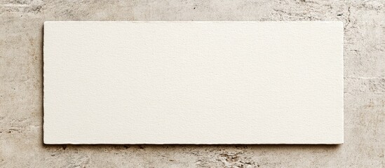 Blank index card mockup on textured gray surface featuring a minimalistic design, soft white background, ideal for showcasing artwork and creativity.