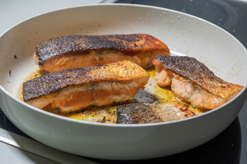 Cooked Salmon Filet in a White Pan Close-Up