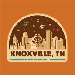 A colorful sticker of a city with a globe in the middle and the words Knoxville, TN
