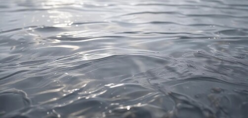 Calming grey gradient background with soft focus and delicate water ripples, abstract water, peaceful atmosphere