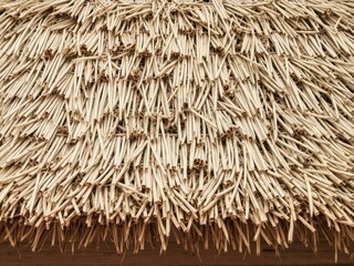 Dry grass roof with a rustic and natural texture, woven, dry