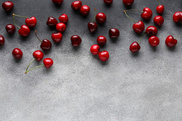 Many sweet cherries on grey background