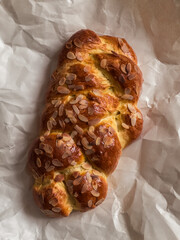 Challah bread on a paper background, top view