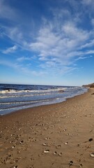 Seashore Landscape with Pebbles Under a Clear Blue Sky