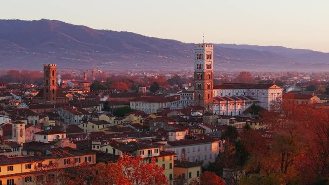 Lucca Cathedral (Duomo di Lucca) And Tower At Sunrise In Lucca, Italy. - aerial shot
